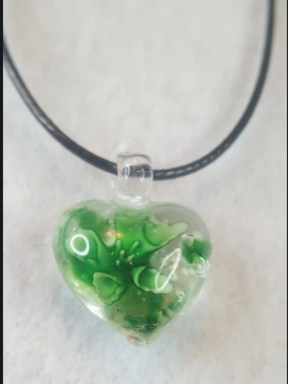 Lampwork glass heart pendant / Green and white flower encased inside clear glass